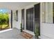 Dark wood front door with black shutters and potted plants at 816 Peyton St, Raleigh, NC 27610