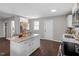 Modern kitchen with white cabinets, marble island, and stainless steel appliances at 816 Peyton St, Raleigh, NC 27610