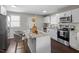 Modern kitchen with white cabinets, granite countertops, and stainless steel appliances at 816 Peyton St, Raleigh, NC 27610