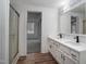 Modern bathroom with double vanity and a walk-in shower at 95 Old Barn Ct, Rocky Mount, NC 27801