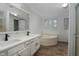 Main bathroom boasts a double vanity, soaking tub, and updated fixtures at 95 Old Barn Ct, Rocky Mount, NC 27801