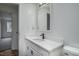 Bathroom with white vanity, quartz countertop and view of bedroom at 95 Old Barn Ct, Rocky Mount, NC 27801