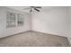 Simple bedroom with carpet, ceiling fan and large window at 95 Old Barn Ct, Rocky Mount, NC 27801