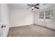 Bright bedroom with neutral carpeting and ample natural light at 95 Old Barn Ct, Rocky Mount, NC 27801