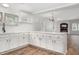 Spacious kitchen featuring white cabinets, quartz countertops, and modern flooring at 95 Old Barn Ct, Rocky Mount, NC 27801
