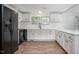 Updated kitchen featuring white cabinets and quartz counters at 95 Old Barn Ct, Rocky Mount, NC 27801