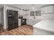 Eat-in kitchen with white cabinets and black appliances at 95 Old Barn Ct, Rocky Mount, NC 27801