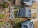 Aerial view showcasing the home's backyard with a garden, fire pit, and playground at 101 Pointe Park Cir, Holly Springs, NC 27540