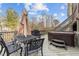 Deck featuring a hot tub, table, seating, and a grill at 101 Pointe Park Cir, Holly Springs, NC 27540