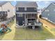 Backyard view of the home with a screened porch, wooden deck, and a playset at 101 Pointe Park Cir, Holly Springs, NC 27540