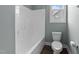 Clean bathroom with a white shower, toilet, and brown tile flooring for a modern look at 101 Pointe Park Cir, Holly Springs, NC 27540