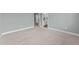 Neutral bedroom featuring carpet and an ensuite bathroom with a white door at 101 Pointe Park Cir, Holly Springs, NC 27540
