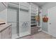 Well-organized closet featuring ample shelving, hanging rods, and stylish light-wood drawers at 101 Pointe Park Cir, Holly Springs, NC 27540