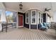 Inviting front porch with seating and stylish red door at 101 Pointe Park Cir, Holly Springs, NC 27540