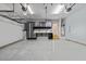 This oversized garage features storage, shop space, shelving, and room for multiple vehicles at 101 Pointe Park Cir, Holly Springs, NC 27540