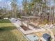 Backyard vegetable garden with raised beds and a wooden trellis at 101 Pointe Park Cir, Holly Springs, NC 27540