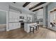 This modern kitchen features an island, stainless steel appliances, and plenty of cabinet space at 101 Pointe Park Cir, Holly Springs, NC 27540