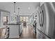 Open concept kitchen with large island and stainless steel appliances at 101 Pointe Park Cir, Holly Springs, NC 27540