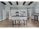 This kitchen features black counters, an island, stainless appliances, and plenty of cabinets at 101 Pointe Park Cir, Holly Springs, NC 27540