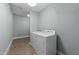 Laundry room with a washer and dryer, plus space for storage and folding at 101 Pointe Park Cir, Holly Springs, NC 27540