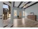 Spacious living room with wood-look floors, ceiling fan, exposed beams, and outdoor access at 101 Pointe Park Cir, Holly Springs, NC 27540