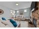 Comfortable living room with a stone fireplace, stylish decor, and an inviting atmosphere at 101 Pointe Park Cir, Holly Springs, NC 27540