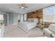 Spacious main bedroom featuring a wood accent wall, ceiling fan, carpet and recessed lighting at 101 Pointe Park Cir, Holly Springs, NC 27540