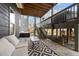 Covered patio featuring outdoor seating and stairs leading to a deck with a hot tub at 101 Pointe Park Cir, Holly Springs, NC 27540