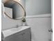 Contemporary powder room with vanity, modern fixtures, and clean, minimalist design at 101 Pointe Park Cir, Holly Springs, NC 27540