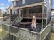 Close up of the backyard wooden deck, showcasing a hot tub and outdoor seating at 101 Pointe Park Cir, Holly Springs, NC 27540