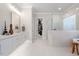 Luxurious bathroom with double vanity, soaking tub, and walk-in shower at 1304 Ivy Ln, Raleigh, NC 27609
