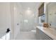 The bathroom features a glass enclosed shower with a modern vanity and bright natural light at 1304 Ivy Ln, Raleigh, NC 27609