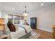 Bright bedroom with hardwood floors, large windows, and chandelier at 1304 Ivy Ln, Raleigh, NC 27609