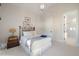 This bedroom has a metal frame bed with an ornate table set next to an ensuite bathroom at 1304 Ivy Ln, Raleigh, NC 27609