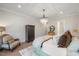 Spacious bedroom with hardwood floors and a large window at 1304 Ivy Ln, Raleigh, NC 27609