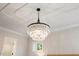 Crystal chandelier adds elegance to a bedroom or living space at 1304 Ivy Ln, Raleigh, NC 27609
