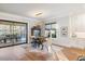 Sunlit dining room with hardwood floors and access to backyard patio at 1304 Ivy Ln, Raleigh, NC 27609