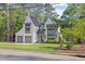 An inviting two-story home is complimented by a well-manicured lawn and a large two-car garage at 1304 Ivy Ln, Raleigh, NC 27609