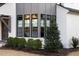 Exterior view of a bay window with black frames and landscaping at 1304 Ivy Ln, Raleigh, NC 27609