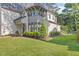 Beautiful home with a manicured lawn, professional landscaping, and modern architectural details at 1304 Ivy Ln, Raleigh, NC 27609