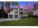 Twilight view of this beautiful two-story home and yard with convenient two-car garage at 1304 Ivy Ln, Raleigh, NC 27609