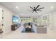 Gathering room with sectional sofa, large TV and ceiling fan at 1304 Ivy Ln, Raleigh, NC 27609
