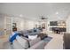 Open and airy Gathering room with sectional sofa and wet bar at 1304 Ivy Ln, Raleigh, NC 27609