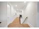 Light-filled hallway with hardwood floors and modern doors at 1304 Ivy Ln, Raleigh, NC 27609