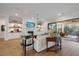 Open living room with fireplace, built-ins and access to porch at 1304 Ivy Ln, Raleigh, NC 27609