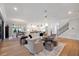 Open living area with hardwood floors and a view of the kitchen at 1304 Ivy Ln, Raleigh, NC 27609