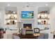 Living room with fireplace and built-in shelving units at 1304 Ivy Ln, Raleigh, NC 27609