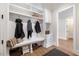 Mudroom with built-in bench, shelves, and coat hooks at 1304 Ivy Ln, Raleigh, NC 27609