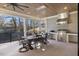 Outdoor kitchen and dining area with wood ceilings, stainless steel grill, and seating for eight at 1304 Ivy Ln, Raleigh, NC 27609