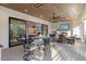 An outdoor living space with fireplace and TV, adjacent to a dining area and the home's interior at 1304 Ivy Ln, Raleigh, NC 27609